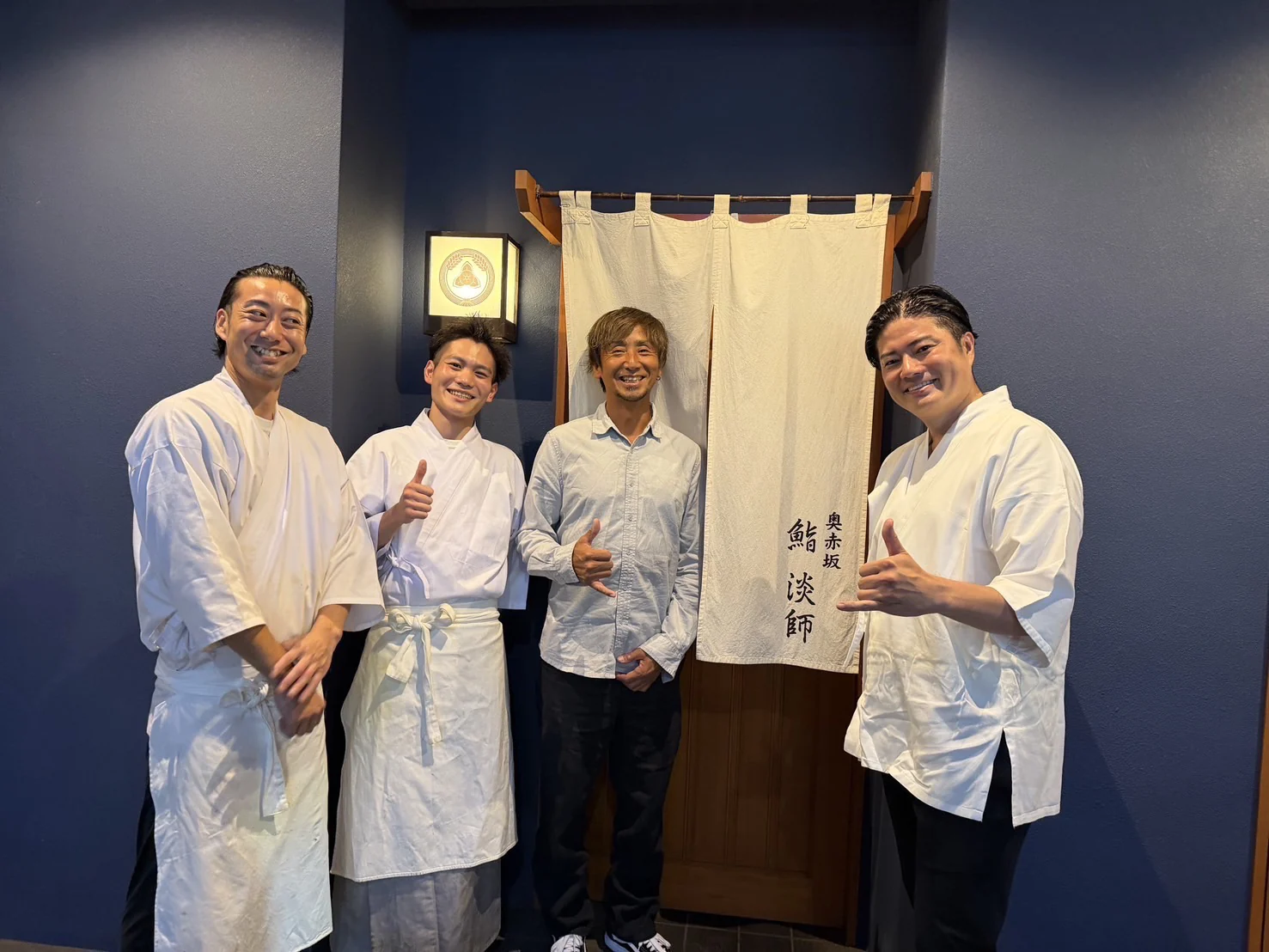 Mr. Tsumoto, who devised the Ultimate Ikejime method, with the chefs of Sushi Tanji at the entrance